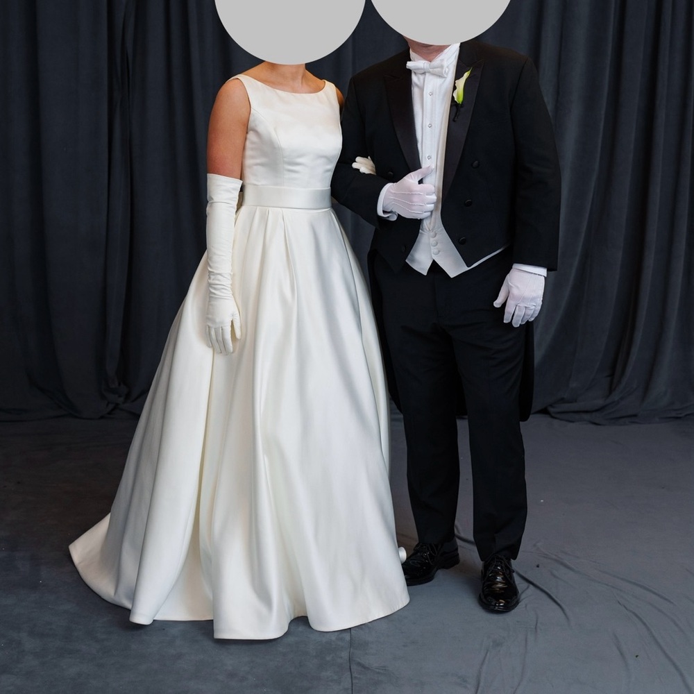 Candlelight ballgown with boatneck, box pleats (hidden pockets), low scoop back